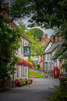 Suffolk Prints: Low Street, Hoxne, Suffolk. The Swan Inn (pub) left, shop & post office - right