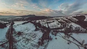 Beskid Prints: Lower Beskid, Carpathian Mountain Range in winter aerial view, orange and pink sky