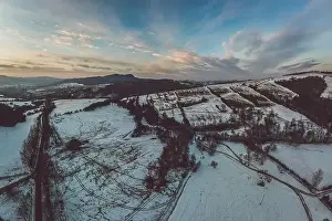 Beskid Prints: Lower Beskid, Carpathian Mountain Range in winter aerial view, orange and pink sky