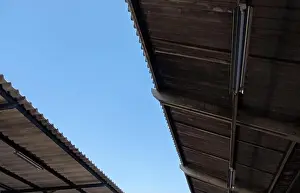 Light Blue Prints: The lower view to the roof tile with the light bulb of the platform in the railway station