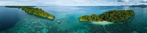 Melanesia Prints: Lush, tropical islands are fringed by robust coral reefs in the Solomon Islands