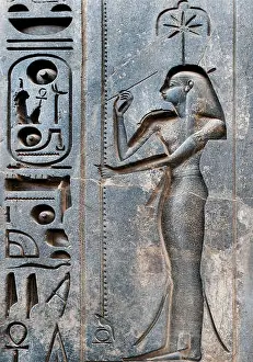Luxor Prints: Luxor, Egypt. Temple of Luxor (Ipet resyt): the writing goddess Seshat carved on the statue of the king Ramses II