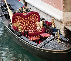 Venezia Prints: Luxurious interior of a gondola in Venice with precious carpets and upholstered chairs