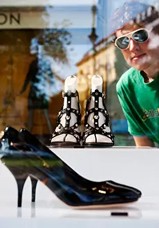 Exclusive Prints: Luxury designer shoes on display in glass cabinet outside Louis Vuitton shop on Kurfurstendamm in Berlin Germany