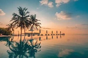Images Dated 6th January 2017: Luxury poolside on the beach with sunset colors. Amazing luxury summer background