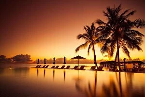 Images Dated 12th December 2015: Luxury swimming pool in beautiful sunset. Luxury summer vacation and holiday concept and design