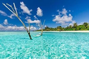 Images Dated 7th May 2018: Luxury water hammock in paradise island sea lagoon. Summer beach travel