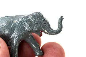On White Prints: Macro photo of a tiny toy elephant from a 1960s Noah's Ark play set by Marx