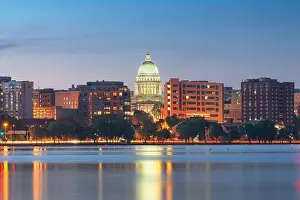 Madison, Wisconsin, USA downtown skyline at dusk on Lake Monona