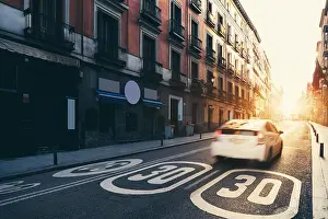 Landmark Place Prints: Madrid City center, old street and buildings during sunrise in Madrid, Spain