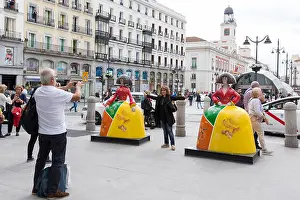 Iberia Prints: Madrid, Spain: Madrid, Spain: Tourists pose with Menina sculptures at Puerta del Sol