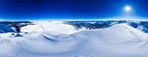 Forest View Prints: Magical panorama of a beautiful hill in the mountains covered by snow on the ski slope on a sunny day with a clear blue