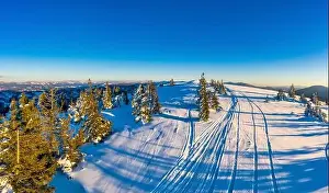 Snowy Mountain Prints: Magical winter panorama of beautiful snowy slopes at a ski resort in Europe on a sunny
