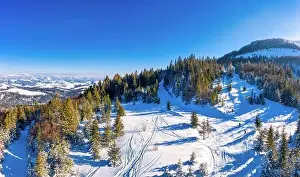 Wintersport Prints: Magical winter panorama of beautiful snowy slopes at a ski resort in Europe on a sunny