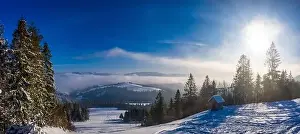 Wintersport Prints: Magical winter panorama of beautiful snowy slopes at a ski resort in Europe on a sunny