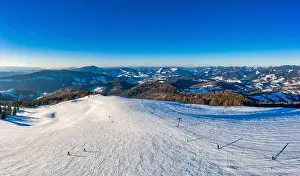 Wintersport Prints: Magical winter panorama of beautiful snowy slopes at a ski resort in Europe on a sunny