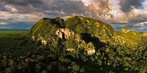 Sky Valley Prints: Magnificent aerial view of a limestone mountain with massive cave entrance