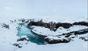 Magnificent view of powerful stream of water reaching end of cliff and falling down in Iceland Godafoss waterfall