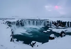 Magnificent view of powerful stream of water reaching end of cliff and falling down in Iceland Godafoss waterfall