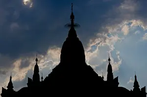 Chedi Prints: Mahanthtoo Kanthat Pagoda, Pyin Oo Lwin, Burma. Silhouette of stupa against sky