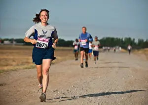 Jogging Prints: Maj. Cynthia Kearley runs during the Air Force Marathon at the Transit Center at Manas