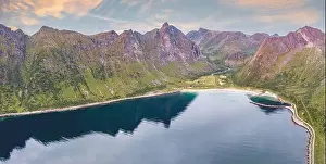 Northern Norway Prints: Majestic mountains surrounding Ersfjord beach reflected in the sea at sunset