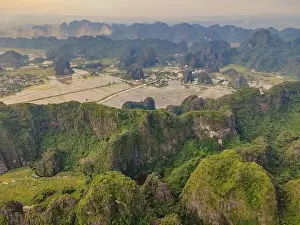 Karst Prints: the majestic scenery on Ngo Dong river in Tam Coc Bich Dong view from drone in Ninh Binh province of Viet Nam