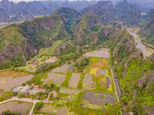 Karst Prints: the majestic scenery on Ngo Dong river in Tam Coc Bich Dong view from drone in Ninh Binh province of Viet Nam