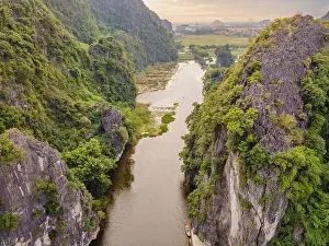 Karst Prints: the majestic scenery on Ngo Dong river in Tam Coc Bich Dong view from drone in Ninh Binh province of Viet Nam