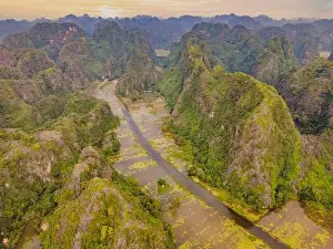 Mountain River Prints: the majestic scenery on Ngo Dong river in Tam Coc Bich Dong view from drone in Ninh Binh province of Viet Nam