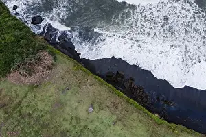 majestic scenic aerial landscape of rocky shore and crashing ocean waves. High quality photo