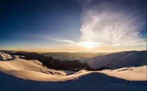 Hill Glacier Prints: Majestic snowy hills located in the mountains on a sunny winter day with blue sky at a ski resort in Europe