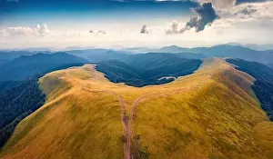 Majestic summer view from flying drone of Menchul mountain range with old country road