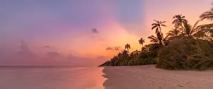 Majestic sunset island beach. Tropical scenic summer landscape. Beautiful natural seaside. Exotic tranquil sand coast sunrise colorful sky, sun rays
