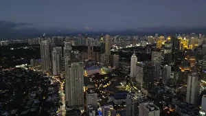 Illuminate Prints: Makati with night skyline filled with illuminated buildings and bustling city life reflecting economic progress