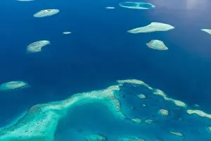 Maldives Beach Reef Sand. taken from different beaches of islands located in Maldives. Aerial view of coral sand cay on Great Barrier Reef, Queensland