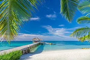Maldives island beach. Tropical landscape of summer scenery, sea sand sky over jetty pier. Luxury travel vacation destination. Exotic beach landscape