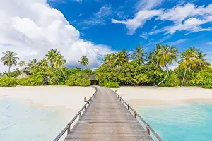 Maldives island beach. Tropical landscape of summer scenery, sea sand sky over jetty pier. Luxury travel vacation destination. Exotic beach landscape