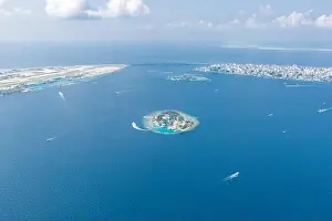 Maldives island capital island, Male. Hulhumale city island view from over the clouds. Aerial landscape in exotic travel destination