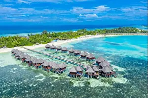 Maldives paradise scenery. Tropical aerial landscape, seascape with long jetty water villas with amazing sea and lagoon beach, tropical nature. Exotic