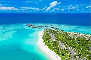 Maldives paradise scenery. Tropical aerial landscape, seascape with long jetty, water villas with amazing sea lagoon beach, tropical nature. Exotic