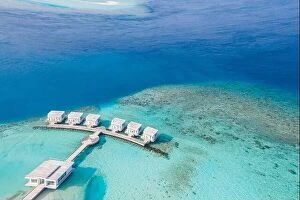Images Dated 11th December 2018: Maldives paradise scenery. top view tropical aerial landscape, seascape with long pier, water villas