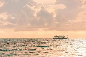 Images Dated 6th May 2018: Maldives Sunset cruise with Dhoni boat in Maldives islands. Tropical sea sunset, seascape