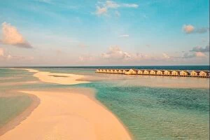 Images Dated 1st February 2022: Maldives sunset paradise. Tropical aerial landscape, seascape with long pier