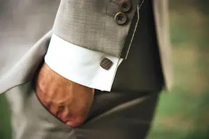 Wrist Prints: Male hand in pocket. Man in grey business suit and white shirt with square cufflinks