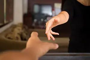 Stretched Prints: Male hands reaching out to help woman from inside