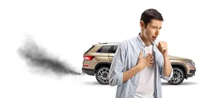 Exhaust Prints: Man coughing from smoke coming out of a vehicle exhaust pipe isolated on white background