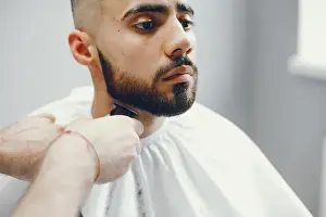 Mans Prints: The man cuts his beard in the barbershop