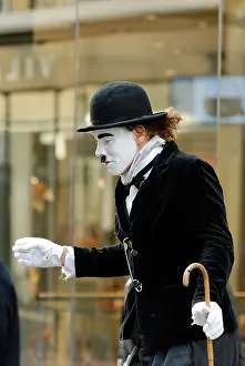 Motionless Prints: Man disguised as Charlie Chaplin Strodet street Copenhagen Denmark
