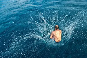 Caucasians Prints: Man doing a cannonball into water, splashing water, Adriatic, Dalmatia, Croatia, Europe